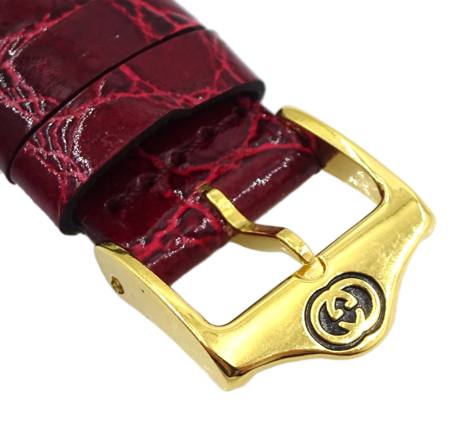 Gucci gold-plated rectangular quartz wristwatch, Ref. 2600M, red and silvered dial, on original red leather strap, boxed