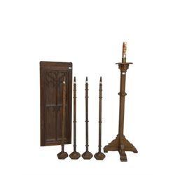 Ecclesiastical oak torchere candle stand; Small panelled oak door with foliate arch applied moulding; set four oak church spokes