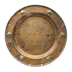 An early 20th century WMF Art Nouveau style copper plate, decorated to the rim with heart shaped motifs, with ostrich mark beneath, D30cm. 
