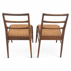 Richard Hornby for Fyne Ladye - mid-20th century afromosia teak dining table, tapered rectangular top with fluted edge and recess for spare leaf, raised on slender legs, four teak framed chairs, of ladder back design, with drop-in seat, upholstered seat, with tapered front legs and slightly raked rear legs,, table unextended width 106cm depth 79cm height 74cm with additional leaf 45cm wide- chairs width 48cm depth 41cm height 87cm 