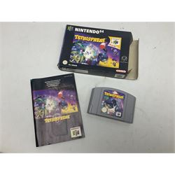 Nintendo 64 console, two controllers, games and accessories. Accessories to include the ‘Tremorpak’ and ‘Spook’ 2 Phono plugs and a S-VHS plug with adapter, both in original boxes. Games to include ‘Golden Eye 007’, ‘Doom 64’, ‘Killer Instinct Gold’, ‘Tetrisphere’, ‘F-1 World Grand Prix’, ‘Pilotwings 64’ and ‘Lylatwars’ with ‘Rumble Pak’, all with original boxes and instruction manuals. ‘Star Wars Episode I Racer’ game cartridge in Shadows of the Empire box. 