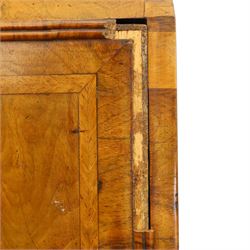 18th century figured walnut bureau, the sloped fall-front enclosing fitted interior with sliding base, pigeon-holes and correspondence drawers with shaped facias, over two short and two long feather-banded drawers with pressed brass handle plates, on bracket feet