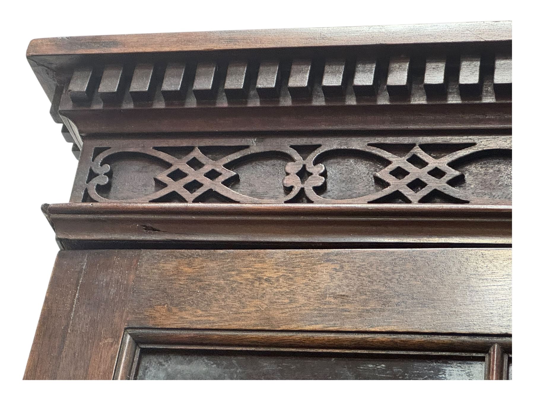 George III mahogany bookcase secretaire, dentil cornice over blind fret work frieze, enclosed by two astragal glazed doors, central secretaire drawer with fall front enclosing leather writing surface and small drawers, two flanking short drawers over double cupboard, on bracket feet