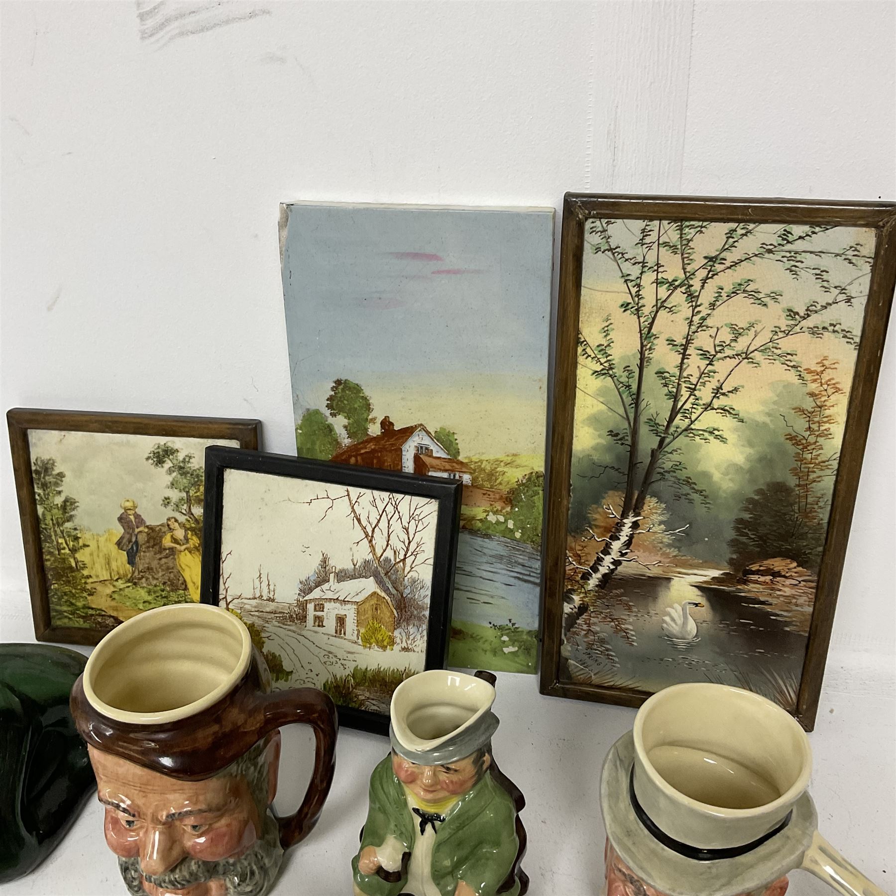 Dimpled green glass bottle, together with painted tiles, a collection of character jugs etc 