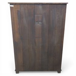  Late 20th century oak four door cupboard in the manner of Titchmarsh and Goodwin, rectangular plank top above two pairs of fielded panel doors with shaped raised panels, central arrangement of a brushing slide above two short drawers with brass swan neck handles and pierced backplates, enclosed by further pair of panelled cupboard doors, fitted with brass butt hinges and turned wooden knobs, raised on plinth base