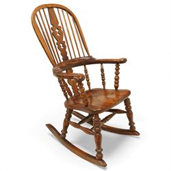 Broadarm Windsor rocking chair, arched crest rail enclosing turned spindle back with pierc...