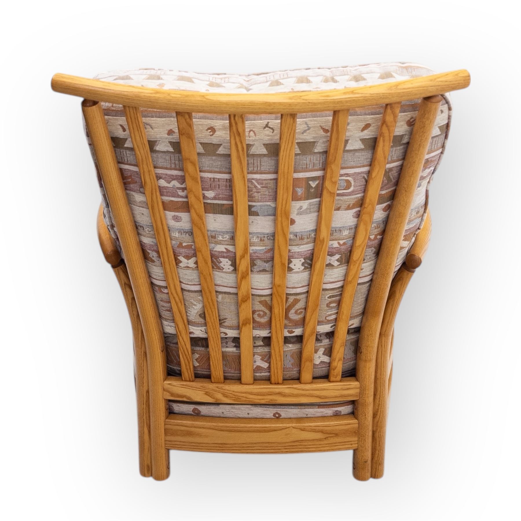 Ercol - Renaissance ash and elm high back armchair, upholstered in geometric Kilim patterned fabric with padded back, seat and arm cushions, curved stick back frame and turned supports