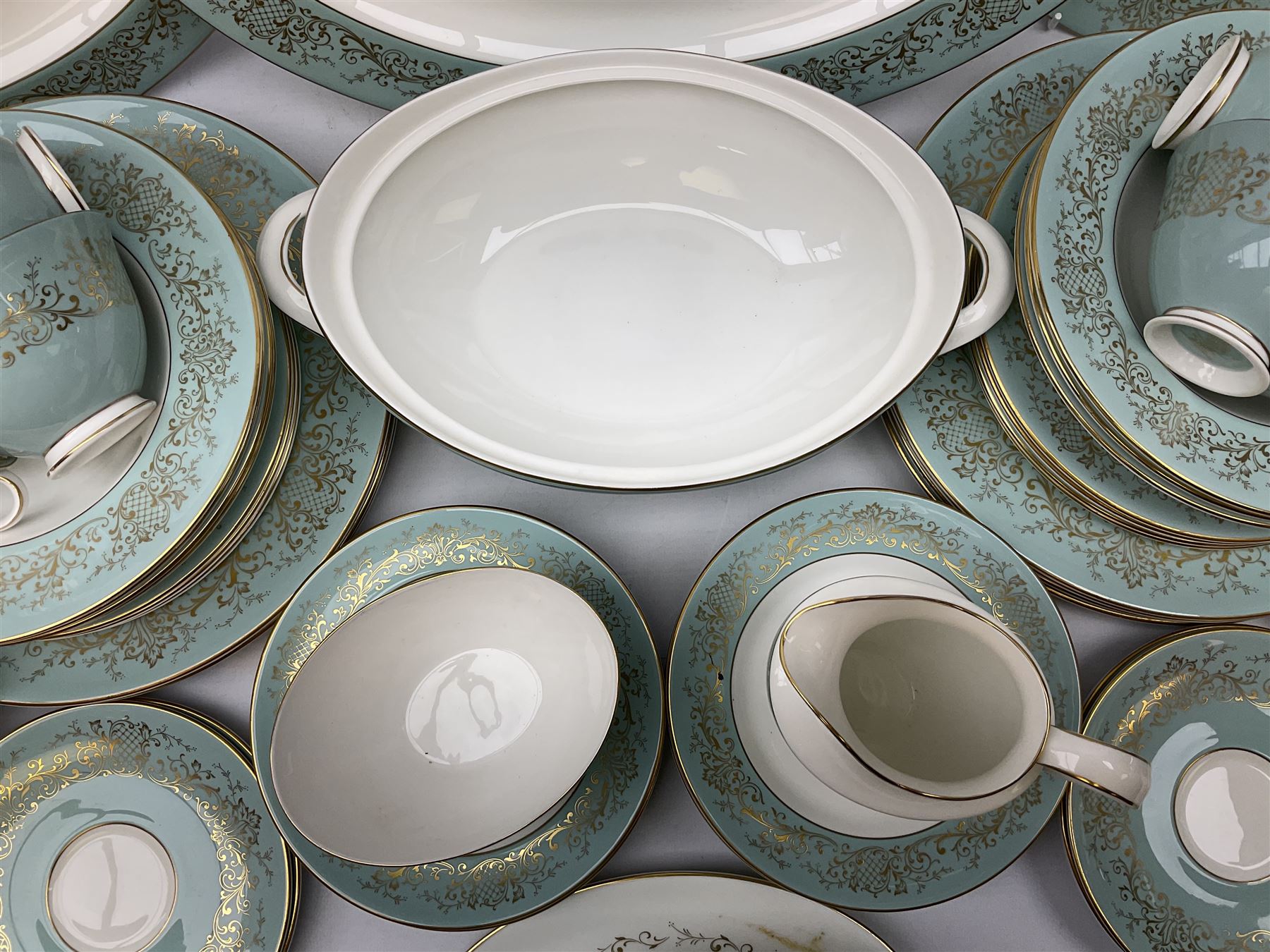 Royal Doulton De Lamerie pattern part tea and dinner service, including eight dinner plates, seven side plates, seven bowls, two serving platters, seven cups and saucers, milk jugs, sucrier, etc (58)