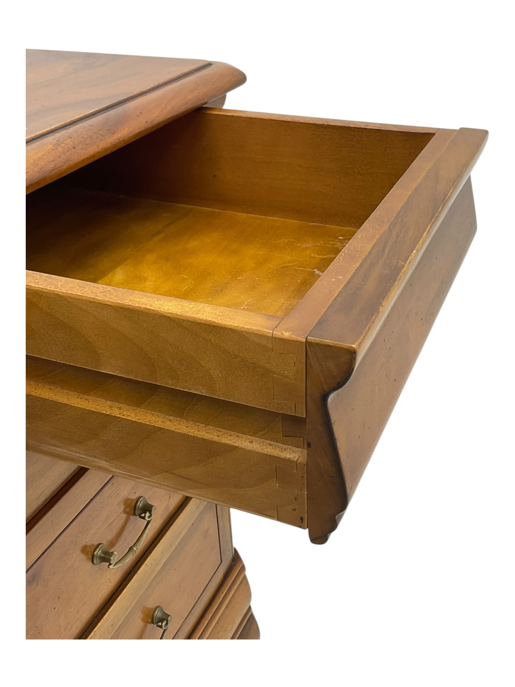 French cherry wood kneehole desk or dressing table, moulded rectangular top over twin pedestal bases each housing three drawers with brass-effect swing handles, resting on bracket feet