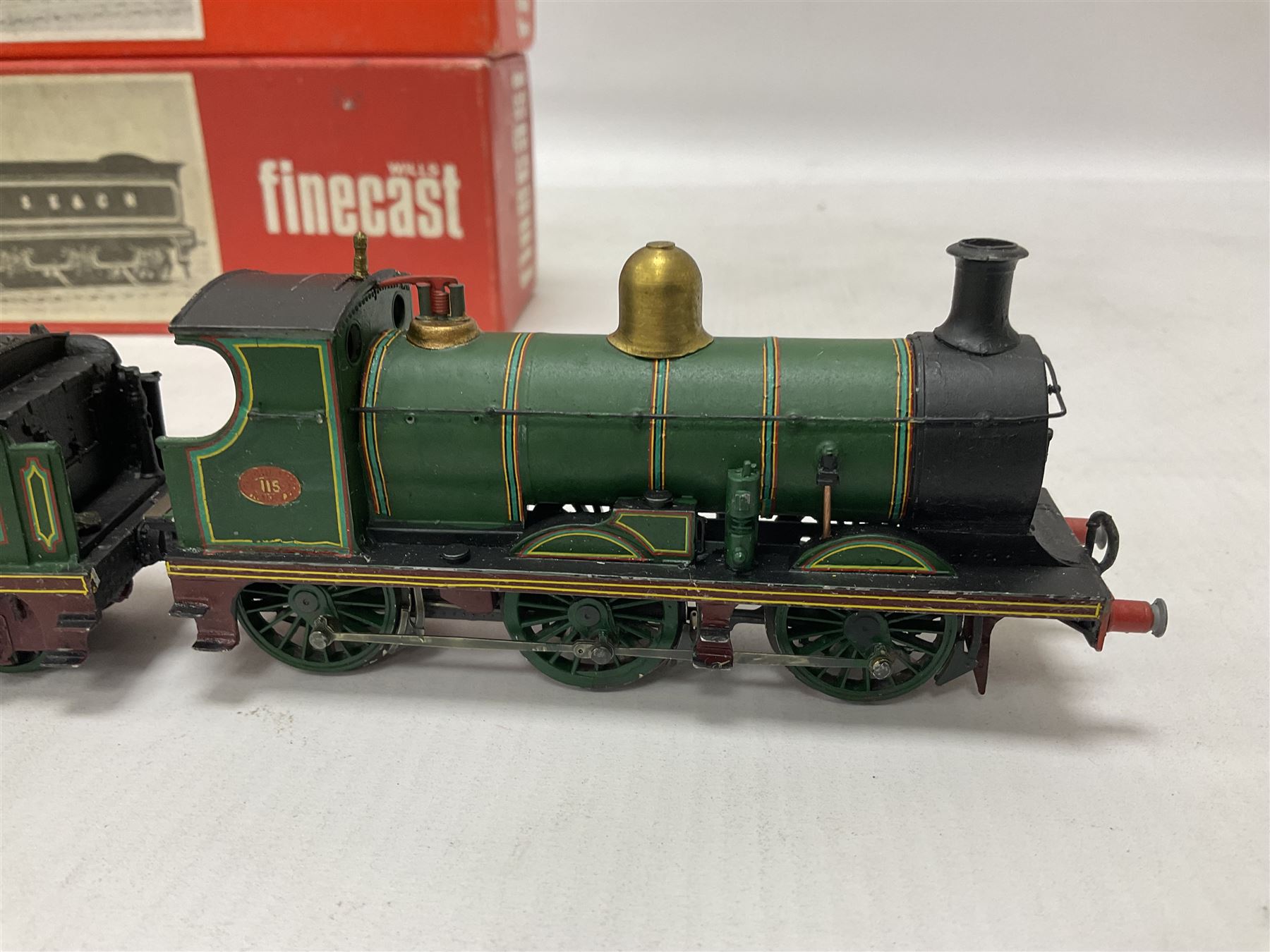‘00’ gauge - two kit built locomotive and tenders comprising SR Wainwright Class C 4-4-0 no.115 finished in SE&CR green; SR Wainwright Class D 4-4-0 no.31750 finished in BR black; both with Wills Finecast boxes (2) 