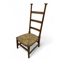 Attributed to William Birch of High Wycombe - Arts & Crafts oak ladder-back side chair, with turned finials, rush seat, and stretchers, raised on square-section supports; 19th century mahogany Pembroke table, rectangular drop-leaf top raised on turned supports with central stretcher and splayed feet