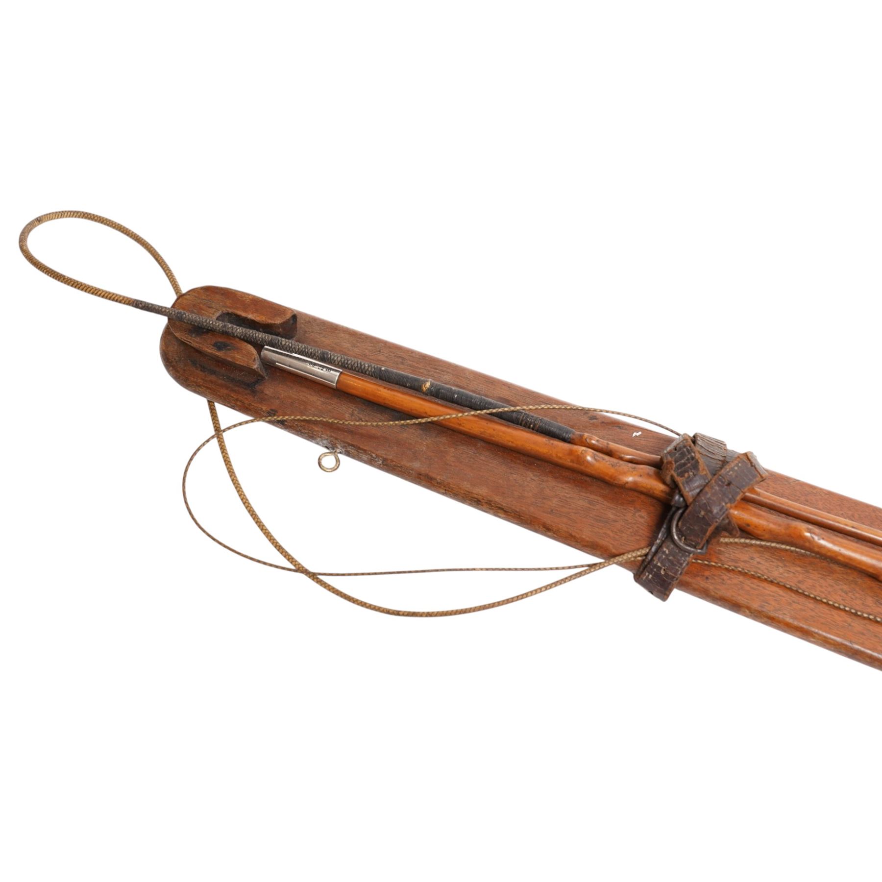 Callow & Son - 19th century travelling coaching whip, the two part yew wood shaft, with silver collars and butt end, hallmarked U & T Walker, London, with leather handle, upon a Callow & Son mount, whip L166cm 