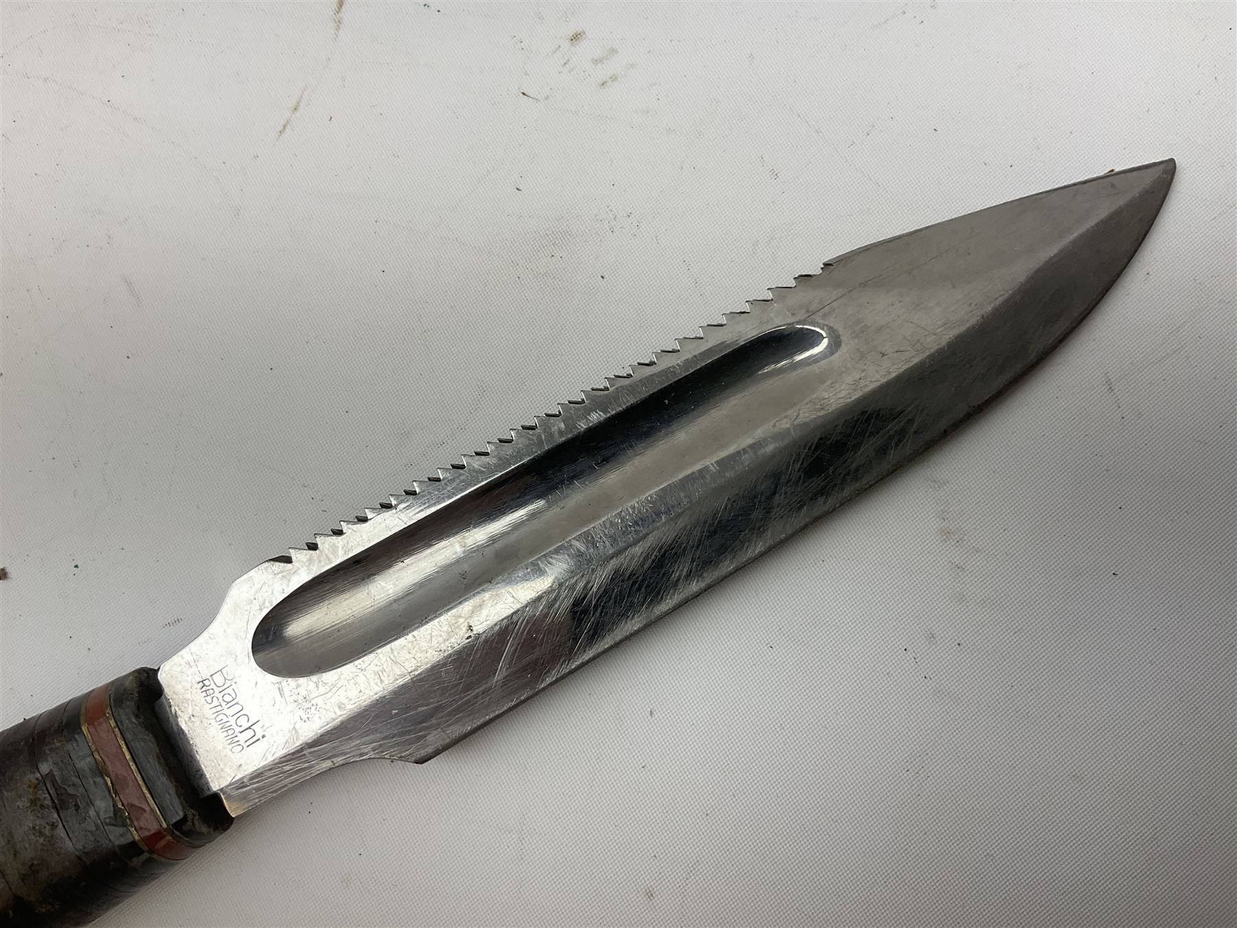 German ERN Wald-Solingen Art Deco style hunting knife with 13cm Bowie type blade and chrome fittings with antler grip; in leather sheath L24.5cm overall; and Bianchi Rastignano Aeronautica Militare combat knife with 15.5cm Bowie type saw-back blade and stacked leather grip (2)