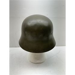 WWII Spanish combat steel helmet model Z, with leather lining and canvas strap, interior D22cm 