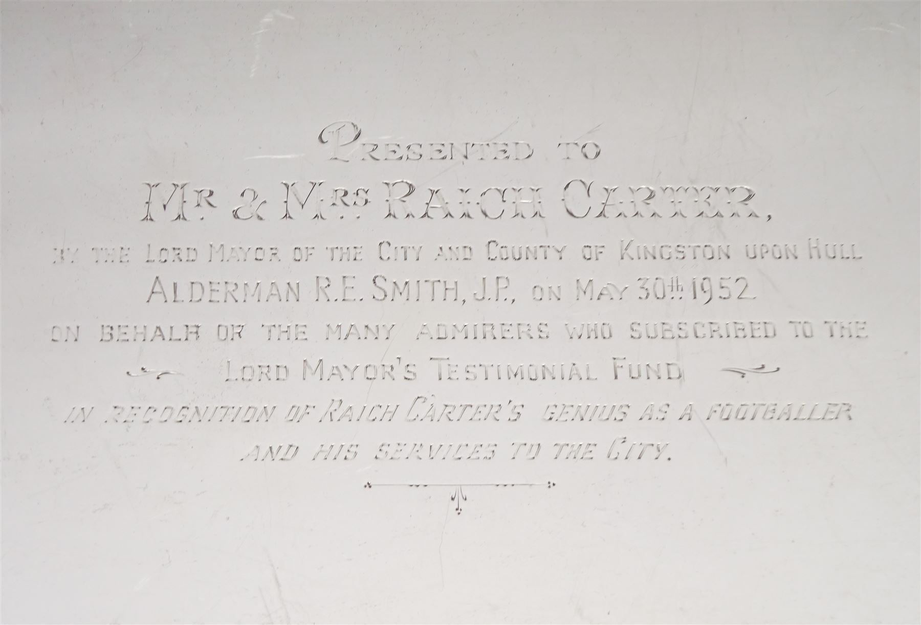 Raich Carter - presentation hallmarked silver two-handled tray of rounded oblong form with gadrooned rim by Wilson & Gill, 139 Regent Street, London, inscribed to the centre 'Presented to Mr. & Mrs. Raich Carter by the Lord Mayor of the City and County of Kingston-upon-Hull Alderman R.E. Smith J.P. on May 30th 1952on behalf of the many Admirers who subscribed to The Lord Mayor's Testimonial Fund in recognition of Raich Carter's genius as a footballer and his services to the City', London 1937 82oz L61cm; together with a hallmarked silver four-piece tea and coffee set by Cooper Bros. & Sons Ltd, the teapot of London shape with ebonised handle and knop, each piece engraved with an initial 'C', Sheffield 1920  60.5oz, teapot L29.5cm
