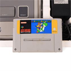 Super Nintendo Entertainment System Pal Version, comprising Super NES Control Deck, Super Mario World Game Pack, two controllers, aerial switch box and AC adapter, boxed