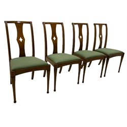 Set of eight contemporary walnut dining chairs, curved backs set with shaped splats with pierced detail, drop in upholstered seat cushions, on turned supports 