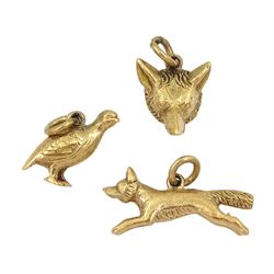 Three 9ct gold charms including foxes head, running fox and grouse bird, all hallmarked