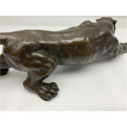 Bronze figure, modelled as a cougar in crouching pose, after Milo and with foundry mark, L40cm