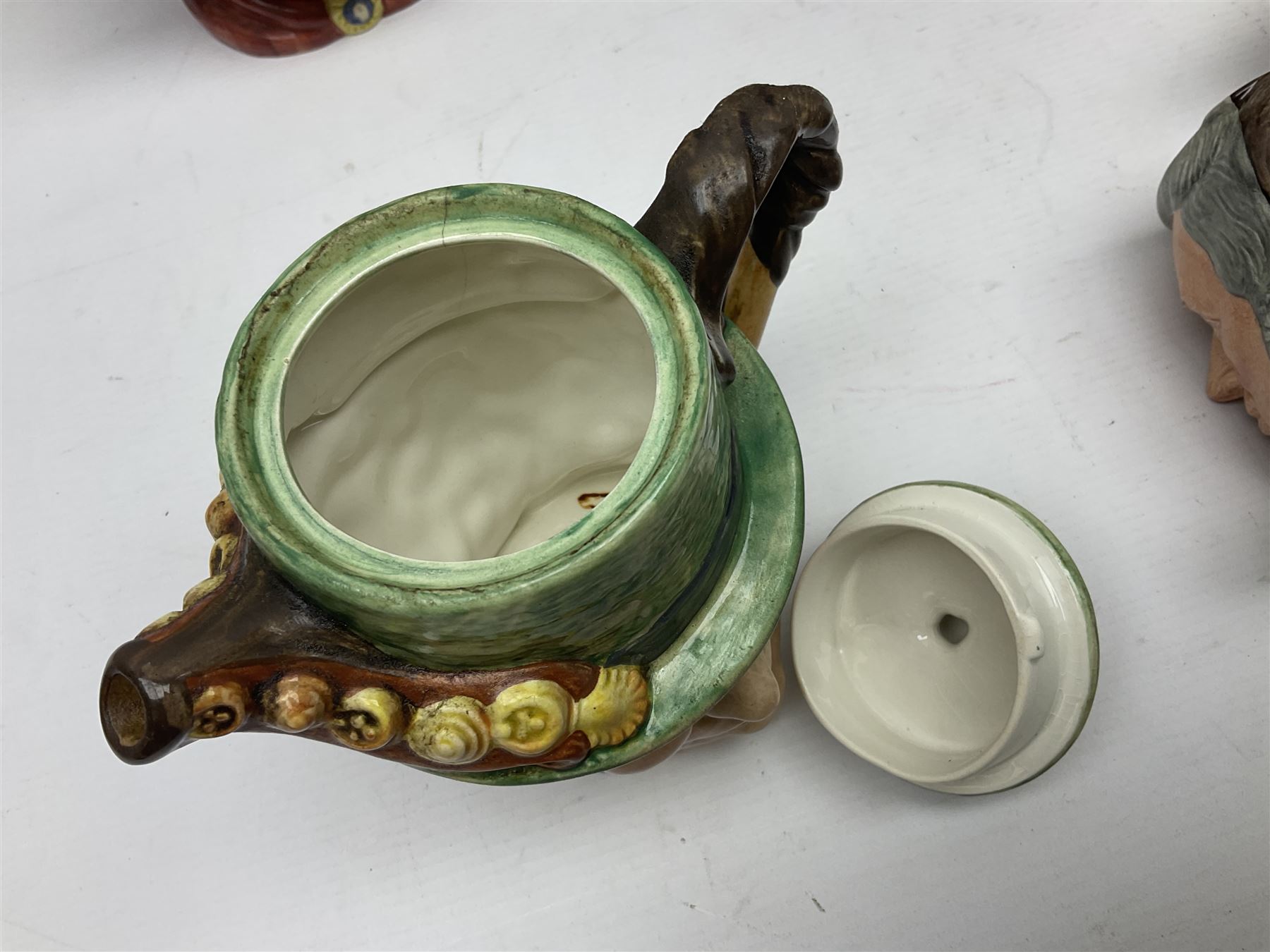 Collection of Royal Doulton and Beswick character jugs of various sizes, including North American Indian D6611, The Falconer D6533,  Tony Weller 281, Sairey Gamp 371 etc