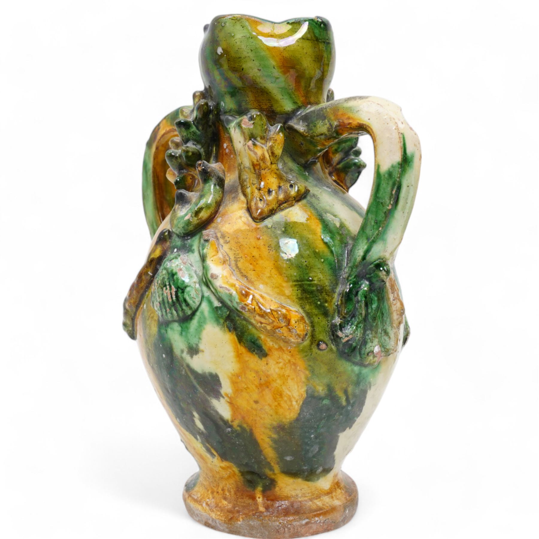 Two early 20th century Italian glazed terracotta wine flasks, one of twin handled form, applied with shells and insects, the other formed as a male figure, H24cm (2)