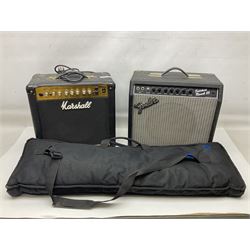 Aria Sinsonido mahogany electric travel guitar, serial no.0502385 L86cm; in original gig bag with earphones and GM11 Minituner; together with Fender Sidekick Reverb 25 amplifier and Marshall MG Series 15DFX amplifier (3)