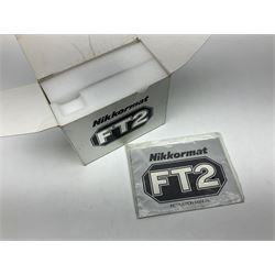 Nikkormat FT2 camera body, serial no. 5066813, in original packaging, together with Nikkormat EL camera body, serial no. 5577358, with Nikon Nikkor 50mm 1:1.8' lens no. 2143575, Nikkormat FT, serial no. 3968385, and Nikomat FT camera body, serial no. 4015491