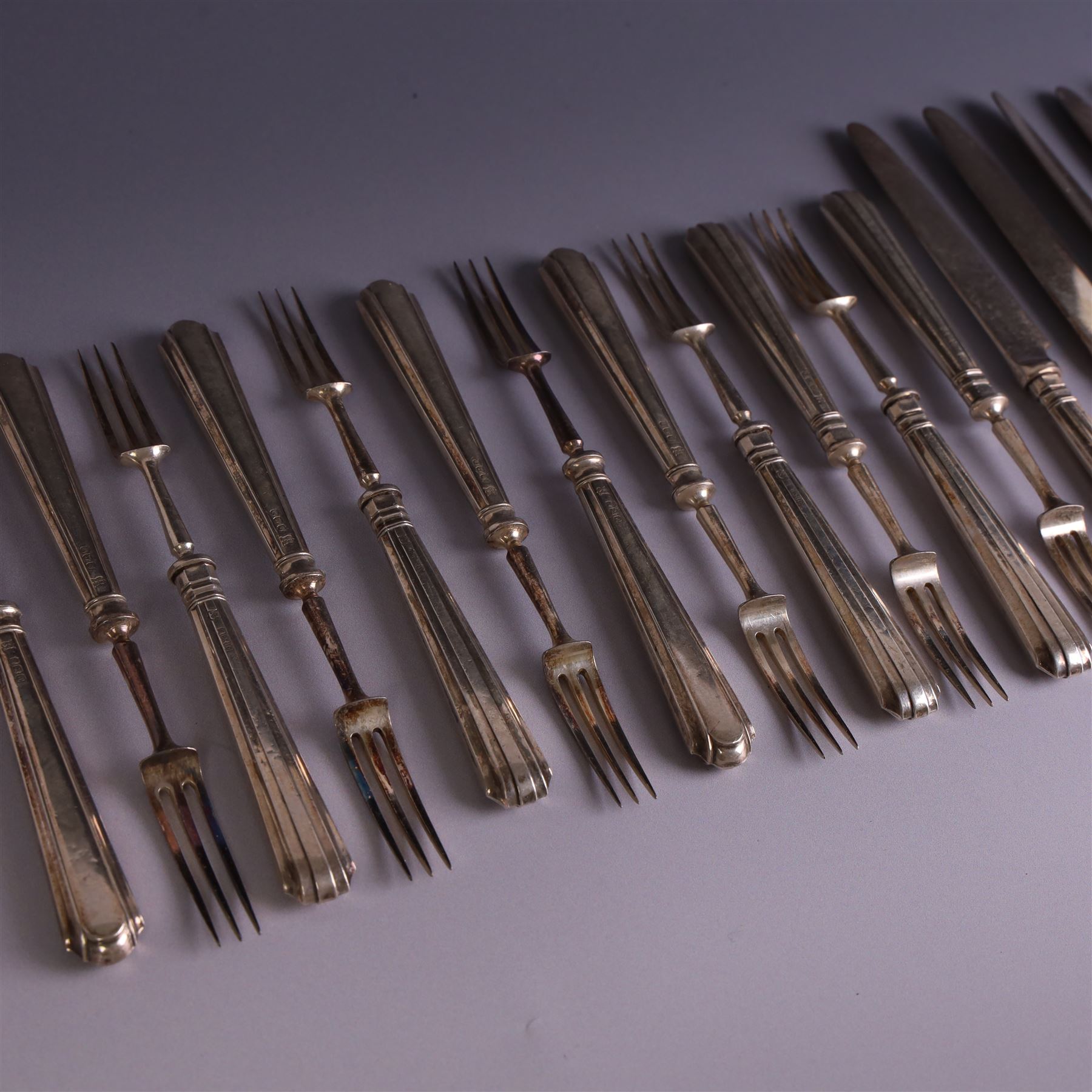 Set of twelve 1920s silver handled dessert knives and forks, hallmarked Thomas Bradbury & Sons Ltd, Sheffield 1921