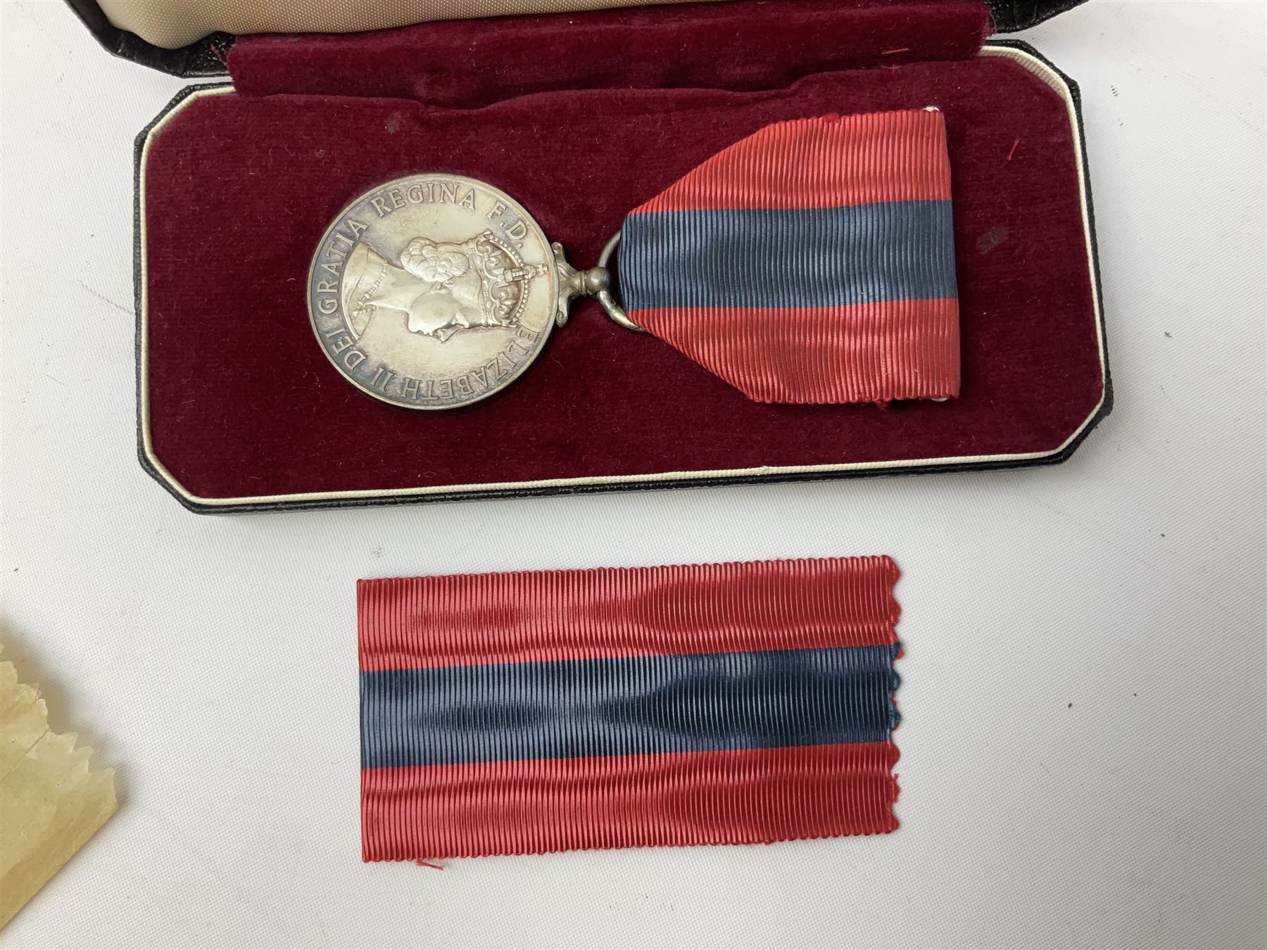 WW1 group of three medals comprising British War Medal and Victory Medal in issue box and Ceylon Volunteer Service Medal awarded to 10288 Pte. M. Smith R. Fus.; together with a later awarded WW2 Defence Medal in modern box with slip; and his QEII Imperial Service Medal in case and box with certificate dated 1959