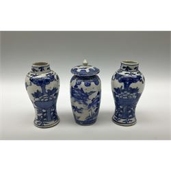 Chinese blue and white bowl D25cm with floral decoration, pair of blue and white baluster vases H12cm and Japanese vase with lid H12cm and Chinese 'mud' figure of a fisherman loose mounted on stepped square wooden base H26cm. 