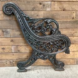 Early 20th century heavy cast iron three piece bench ends, decorated with scrolls and floral swags