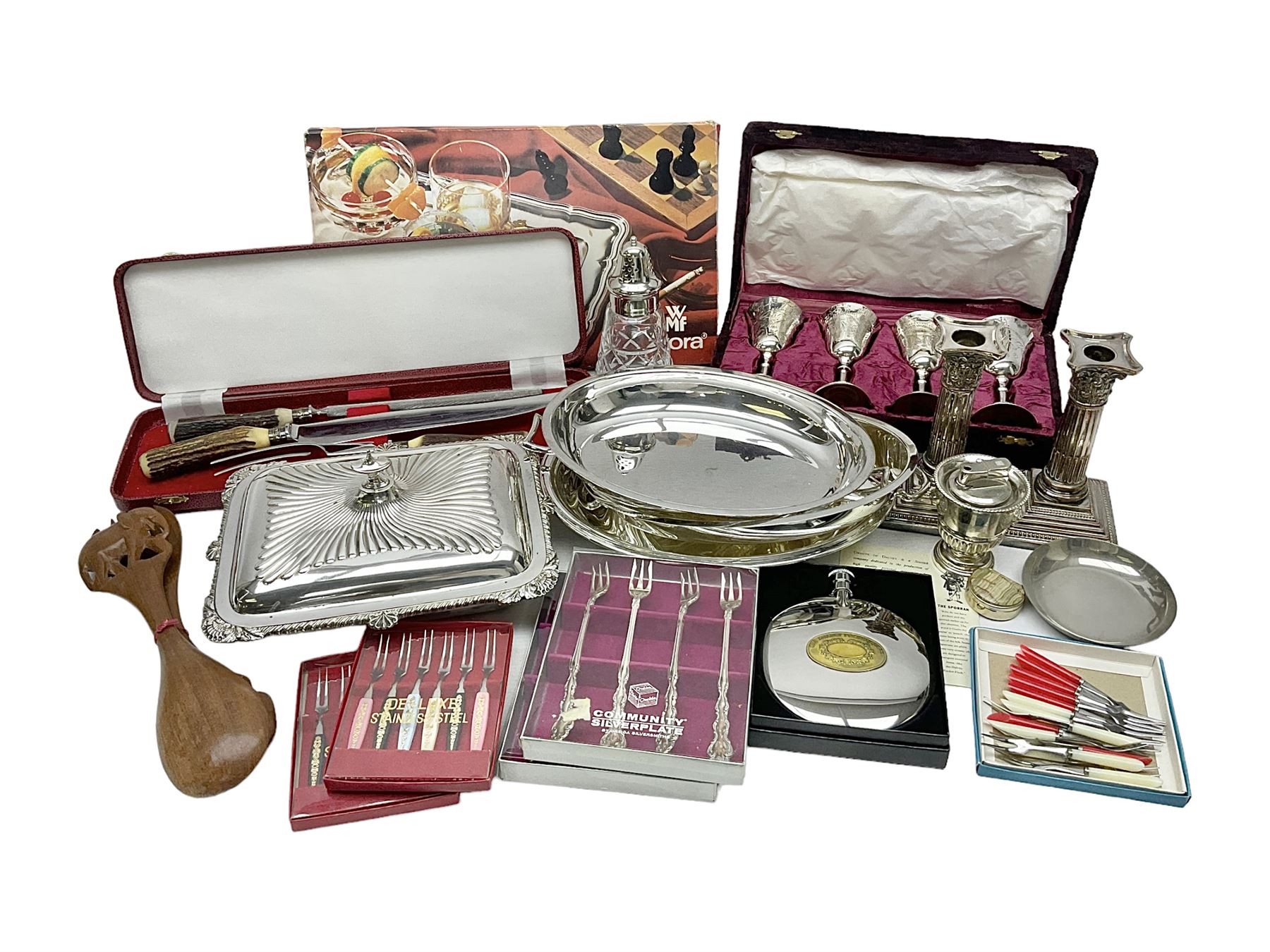 Silver plated Calibri lighter, in the form of a twin handled vase with mask handles, together with a pair of silver plated candle sticks, horn handled carving set with hallmarked silver ferrules and other silver plated items