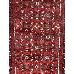 North West Persian Malayer runner, red ground field decorated with Herati motifs, guarded border decorated with trailing flowerhead band 