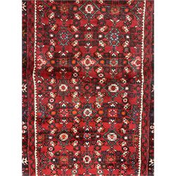 North West Persian Malayer runner, red ground field decorated with Herati motifs, guarded border decorated with trailing flowerhead band 
