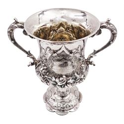  Victorian silver trophy cup, decorated in high relief with flower heads and scrolls, engraved to body 'Challenge Cup presented by Lieut Colonel W.A.White to the Head Quarters Rifle Club 1st V.B.P.W.O West Yorks Reg 1901' with twin acanthus capped scroll handles, upon knopped stem and lobed circular foot embossed with flower heads, hallmarked 	Robert Harper, London 1862, including handles H26.5cm