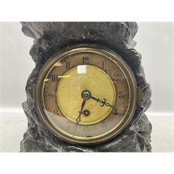 Early 20th century spelter effect figure of a sailor standing in the bow of a boat scanning the horizon, on a simulated rock base with a plaque entitled 'Rescue', base fitted with a timepiece clock movement and two-part dial, with pierced hands, gilt dial centre and ivorene chapter ring written in Arabic numerals, German HAC spring driven going barrel movement wound from the front; with pendulum H65.5cm
