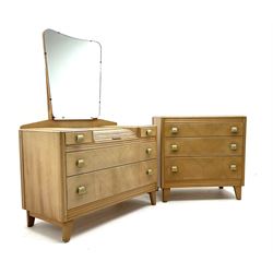 Early 20th century Lebus Furniture light oak dressing table, swing mirror above tambour slide, two short and two graduating drawers, shaped supports, (W99cm, D48cm, H120cm), together with matching light oak chest, three long graduating drawers, on shaped supports (W76cm, D46cm, H76cm), also with matching light oak 4’ 6” double bedstead 