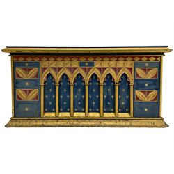 In the manner of William Burges - mid-to-late 19th century English Gothic Revival pine altar or console table, in blue and red paint with water gilding, the moulded rectangular top over six pointed arches with turned column supports, the front carved with a single row of lozenges and incised stylised motifs