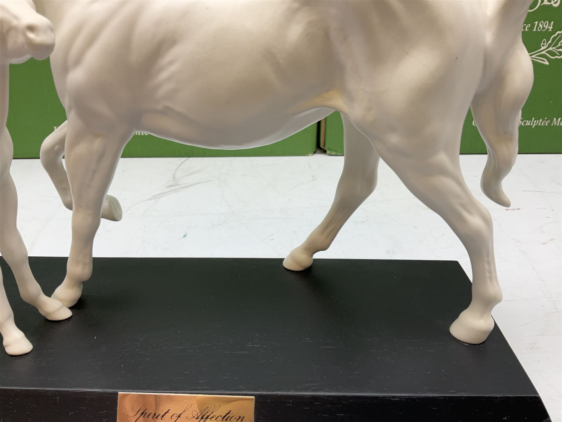 Five Beswick and Royal Doulton horse figures in matt white on black plinths, comprising of  Spirit of Affection no. 2689/2536, Springtime no.2837, Spirit of peace no.2916, Spirit of earth no.2914 and Spirit of the wild no. 183, together with a composite figure of a horse (6)