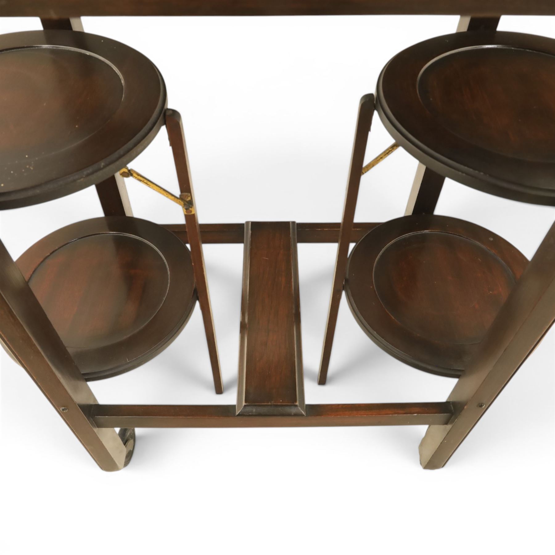 Early 20th century side table with double cake stand, rectangular moulded top, cake stands either side with support, raised on square legs terminating in castors