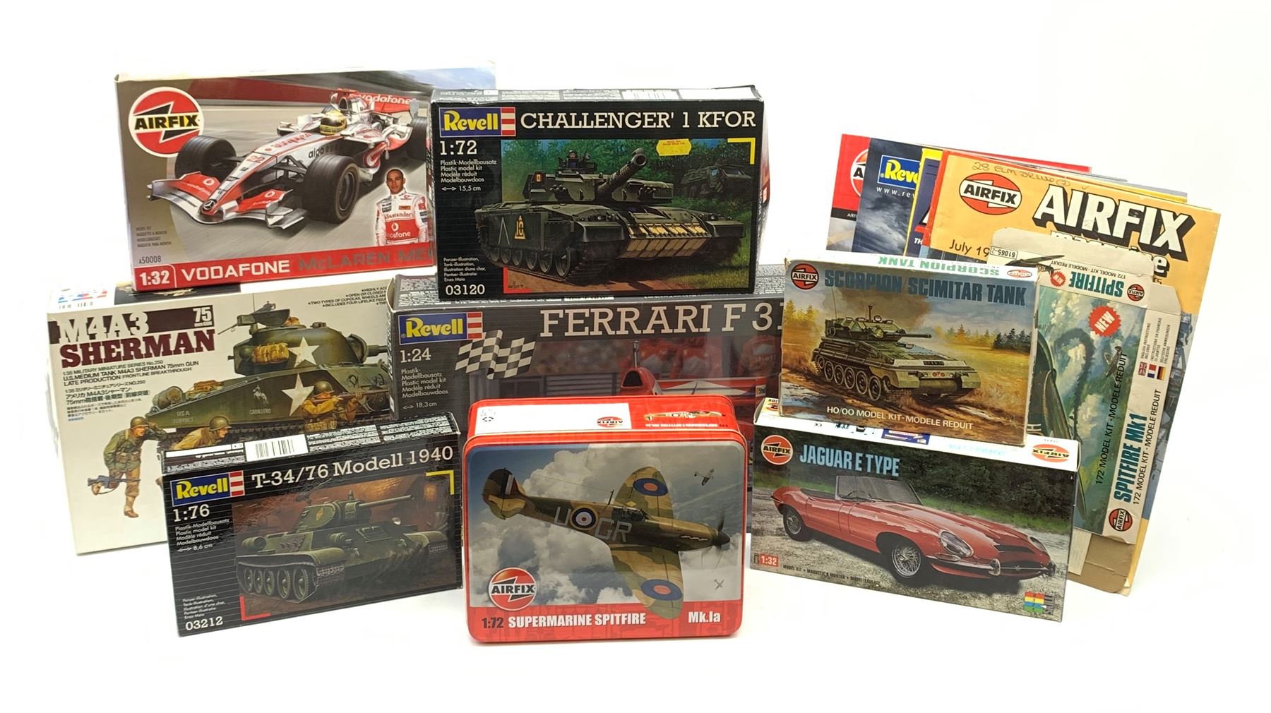 Seven plastic model construction kits - Airfix Vodaphone McLaren Mercedes racing car and Jaguar 'E' Type, Revell Ferrari F310B racing car and four tanks by Airfix, Revell and Tamiya; all boxed in factory sealed transparent packaging; together with an Airfix Spitfire kit tin, various model instruction sheets, catalogues and magazines.
