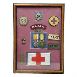 WW1 pair of medals comprising British War Medal and Victory Medal awarded to 493 Pte. H. Everett R.A.M.C.; with ribbons; mounted and framed with metal cap and lapel badges, various shoulder titles, cloth wound badge, armband and other cloth badges