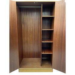 E. Gomme for G-Plan - 'Brandon' light oak double wardrobe, the interior fitted with hanging rail and shelves 