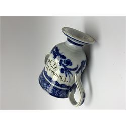 Late 18th century blue and white pearlware loving cup, the bell shaped bowl inscribed Thomas Holms 1796, and further detailed with floral motifs bellow a diamond hatched band, raised upon a circular spreading base, H13.5cm