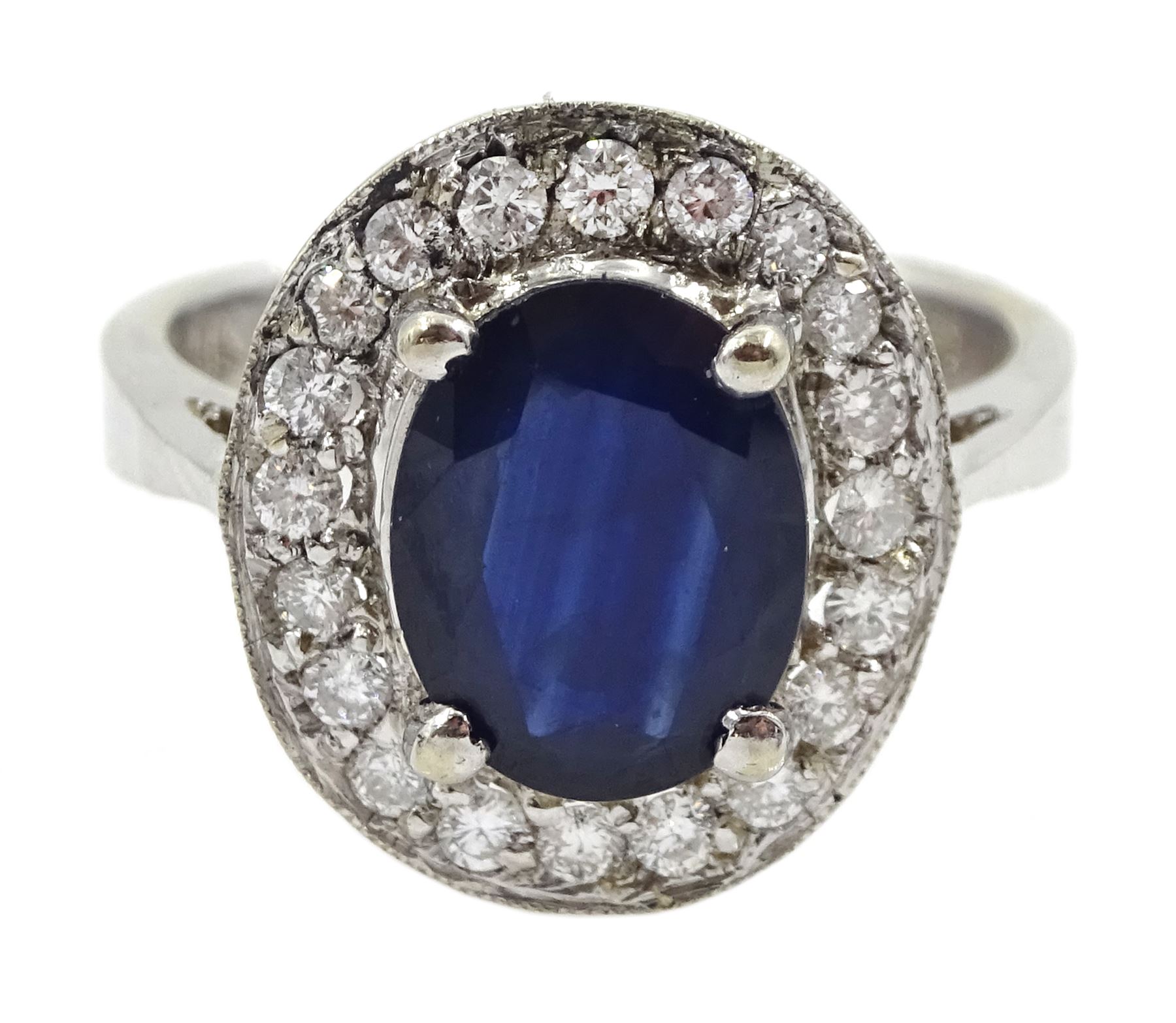 White gold oval sapphire and diamond cluster ring, stamped 14K, sapphire approx 2.00 carat