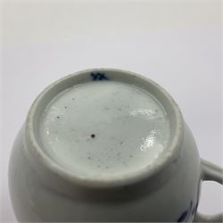 Two 18th century Worcester porcelain coffee cups, the first example decorated in the Plantation pattern, circa 1754, the second decorated in the Mansfield pattern, circa 1760, with workman's mark beneath, each approximately H5.5cm