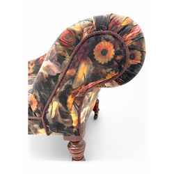 Victorian hardwood-framed chaise longue, serpentine back with rolled arm, upholstered in floral pattern fabric, on ring turned legs with ceramic castors 