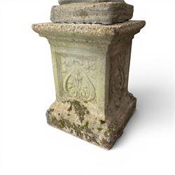 Weathered cast stone statue of a child and urn planter on pedestal along with three piece bird bath