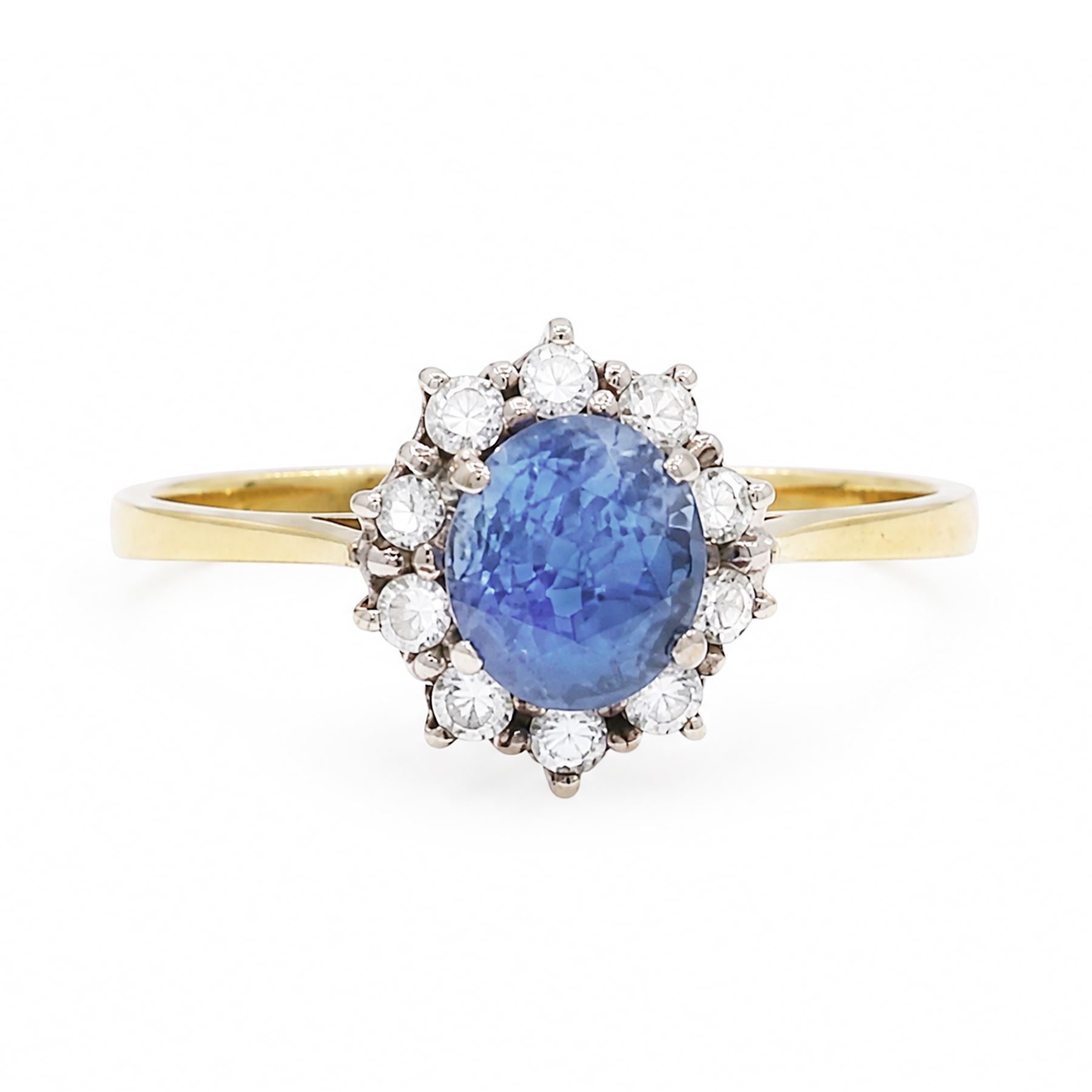 18ct gold sapphire and diamond cluster ring, oval cut sapphire of approx 1.50 carat, surrounded by ten round brilliant cut diamonds, Birmingham import mark 1981, total diamond weight approx 0.30 carat