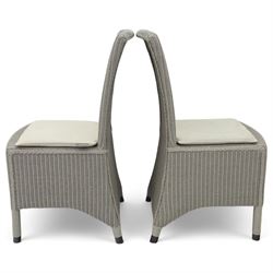 Neptune – Sheldrake limed oak extendable dining table and eight Havan loom chairs, the oval top in limed oak finish with four additional leaves extending the table to seat up to ten (Extends to cm), raised on turned legs with two additional centre supports, the matching Havan loom chairs finished in grey with cream upholstered seat covers (H 95cm, W 47cm, D 55cm)
